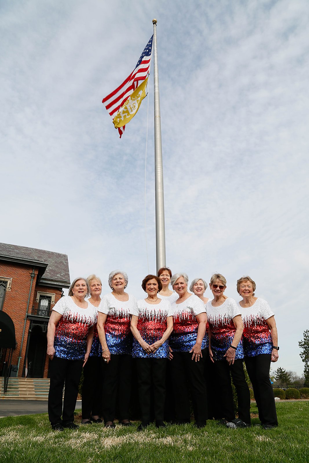 Sweet Harmony singers under American and Kentucky flags