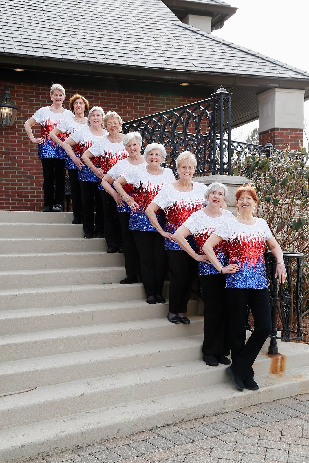 Sweet Harmony singers cascading down outdoor stairs